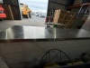 ANVIL AIRE REFRIGERATED SHOWCASE. 3 1/2 DOORS. MODEL: UBG6240. SERIAL: UBG6240/0918/302. STAINLESS STEEL. ON CASTORS. THREE WIRE SHELVES. 220-240 VOLT. APPROX: 2400MM (W) 610MM (D) X 950MM (H). - 4