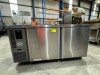 HOSHIZAKI UNDER COUNTER FREEZER. TWO DOOR. MODEL: FTC-150MNA. SERIAL: G00878C. 230 VOLT. STAINLESS STEEL. FOUR WIRE SHELVES. NOTE: RUST MARKS AT RIGHT HAND SIDE ON TOP AND ON RIGHT HAND SIDE ON BOTTOM. ON CASTORS. APPROX: 1500MM (W) X 600MM (D) X 800MM (H