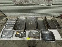 ASSORTED STAINLESS STEEL DISHES & LIDS IN VERIOUS SIZES.