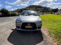2014 MITSUBISHI LANCER XLS. 5 SPEED MANUAL. REGO CB09QN. VIN JMFSNCY5AFU000314. ODOMETER 118722 KM (SHOWING). FULL ELECTRICS. MULTI-FUNCTION CONTROL SCREEN. 9 SPEAKER STEREO CD/DVD. SUBWOOFER. TAILORED SEATCOVERS. HEATED FRONT SEATS. SIDE SKIRTS. REAR SPO